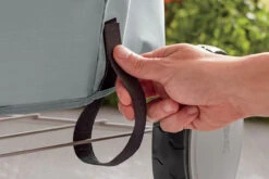 Weber® 57cm Charcoal Barbecue Cover, Polyester -Weber close up detail of the securing strap on the weber 57cm charcoal barbecue cover polyester 39491.1626619310